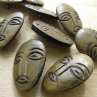 Carved horn face buttons