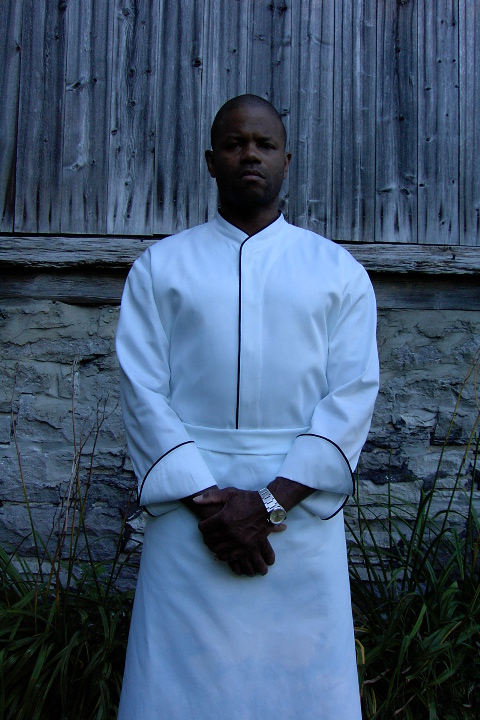 Chef Coat Style CBM103H: Shown in white, 100% cotton Supima gabardine, with black piping (collar, front & cuffs).