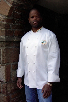 The Culinary Institute of America Chef Jacket (Chef Coat) Style CIAM: Shown in White 100% cotton gabardine, hand tied and hand sewn cloth knot buttons, two top inside buttons, mandarin collar with double piping and right shoulder sleeve patch pocket . Embroidered with the CIA's "1946" logo on left chest.