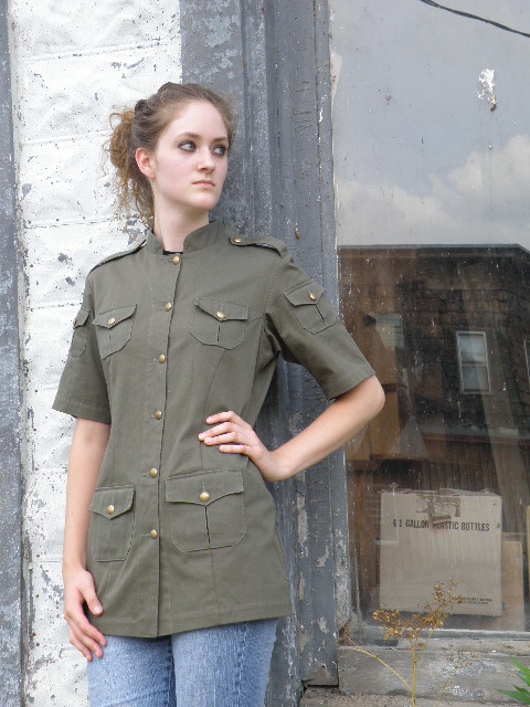 Women's Chef Coat Style BSW104: Shown in Jalapeno green @ Tiger Stripe Camo, 100% cotton denim and 100% combed cotton ripstop, 6 pockets, short sleeves, & brass buttons.