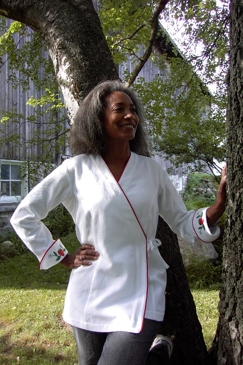 Women's Chef Coat Style BSW106: Shown in White, 100% cotton petti point pique, red berry piping (cuffs, collar & front), & strawberries & flowers embroidery (one on each cuff).
