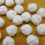 White gabardine hand tied cloth knot buttons