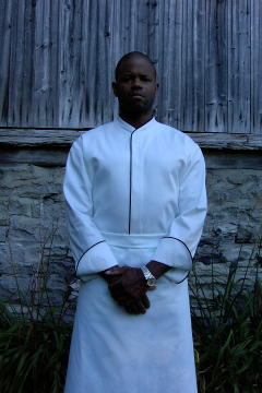 Chef Coat Style CBM103H: Shown in white, 100% cotton Supima® gabardine, with black piping (collar, front & cuffs).