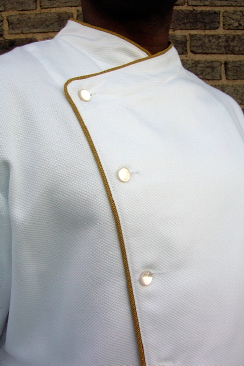Chef Coat Style BSM105: Shown in white, 100% cotton petti point pique, cheviot gold piping (collar, front & cuffs) & faux mother-of-pearl buttons.