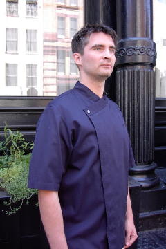 Chef Coat Style BSM105H: Shown in navy, 100% cotton Gabardine, short sleeves, left chest tailored welt pocket & one abalone button.