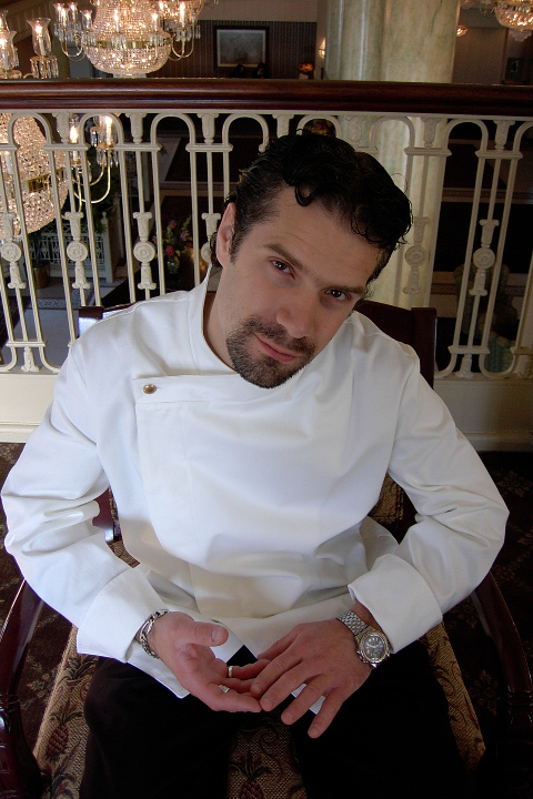 Chef Coat Style BSM105H: Shown in white, 100% cotton gabardine with one brass button.