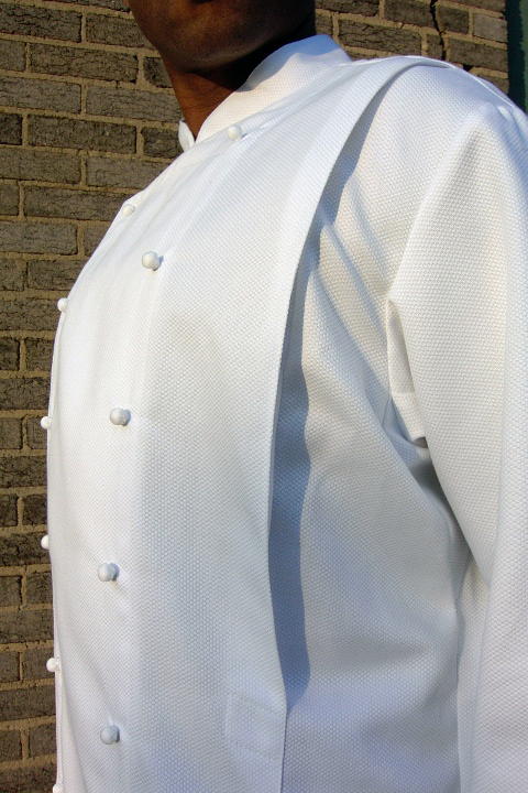 Chef Coat Style BSM108: Shown in white, 100% cotton petti point pique, kissing collar, front & back pleats & ball buttons.