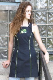 Women's Bib apron style W740; Shown in black, 100% cotton Ripstop with Lime piping along princess seams, & embroidered Lime Botanical on center chest.