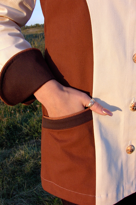 Women's Chef Coat Style BSW103: Shown in ivory, nutmeg & espresso, 100% cotton denim, date piping (collar, front, cuffs & pockets) two front hip tailored welt pockets, & burnt bone buttons.