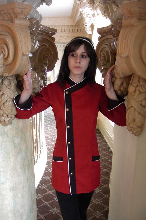 Women's Chef Coat Style BSW105: Shown in Red & Black 100% cotton gabardine, with Snow White piping, two front-hip tailored welt pockets, & brass buttons.