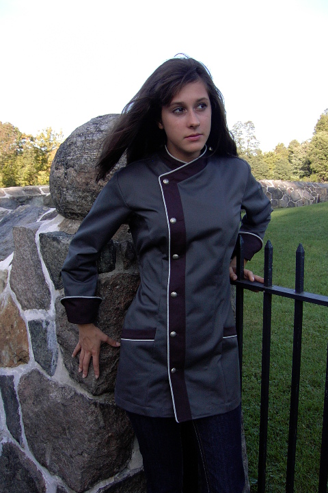 Women's Chef Coat Style BSW105: Shown in graphite & charcoal, 100% cotton gabardine, with natural white piping, two front-hip tailored welt pockets, & concho buttons.