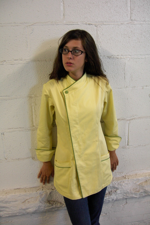 Women's Chef Coat Style BSW105H; Shown in Yellow 100% certified organic cotton gabardine with meadow piping (collar, front, cuffs & pockets) & one peapod green self-covered top button.