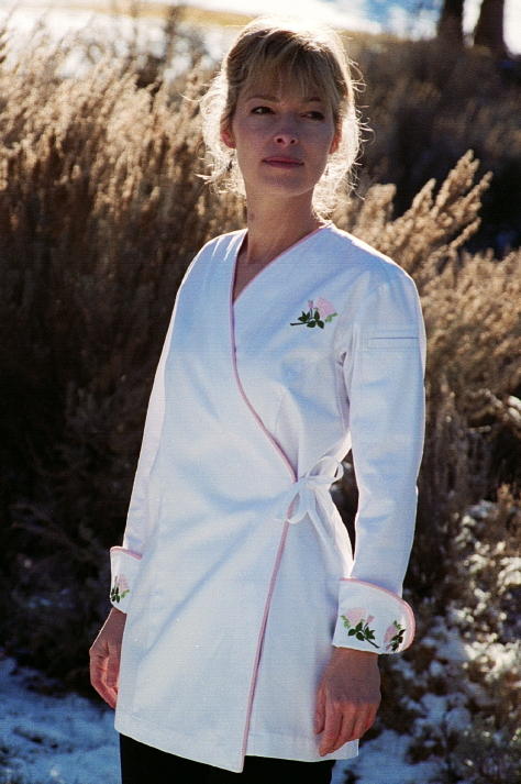 Women's Chef Coat Style BSW106: Shown in White, 100% cotton gabardine, Pink Sham piping (cuffs, collar & front), left sleeve tailored welt pocket & Rose embroidery (3 on each cuff & one on the left chest).