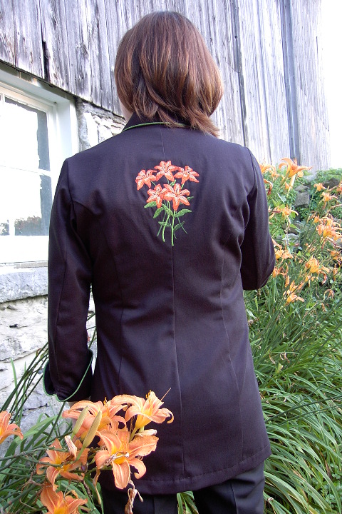 Women's Chef Coat Style BSW109: Shown in Black, 100% cotton gabardine, Meadow piping (collar, cuffs and front), Awabi buttons & Tiger Lilly embroidery (chest, cuffs & back).